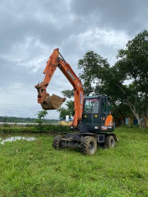 Tìm hiểu về giá máy xúc Doosan 55W cũ: Thị trường và Những Yếu tố Quan trọng